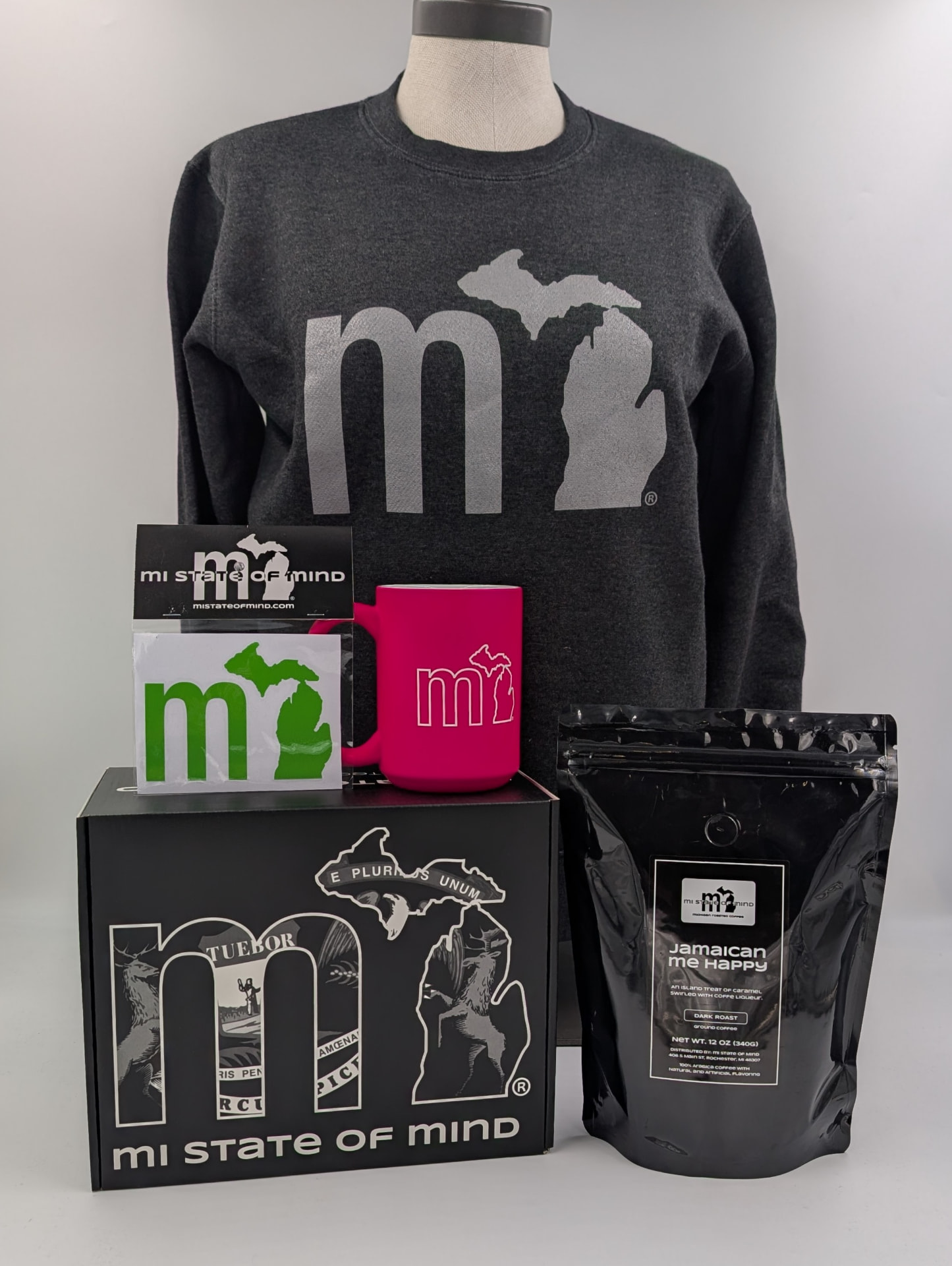 mi Downtown Crew in charcoal grey with a grey mi print, packed in a Michigander Box with coffee, a Megawatt Mug and a mi sticker