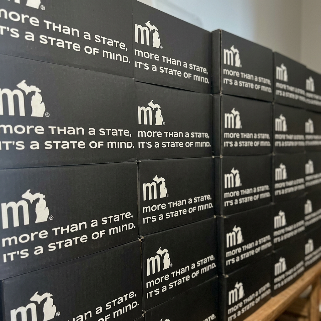 Stack of mi State of Mind gift boxes — 'more than a state, it's a state of mind'